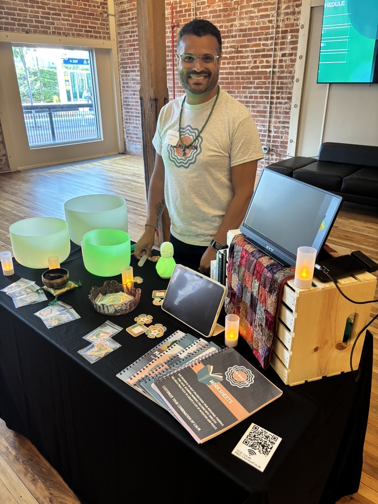 Calmbination workshop table with crystal singing bowls and worksheets
